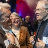 Bill Reilly, Susan Dickerson-Lange, and Jay Inslee in conversation
