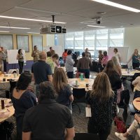 A conference room full of scientists and partners